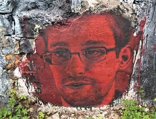 A red-tinted painting of a bespectacled young man with a goatee.
