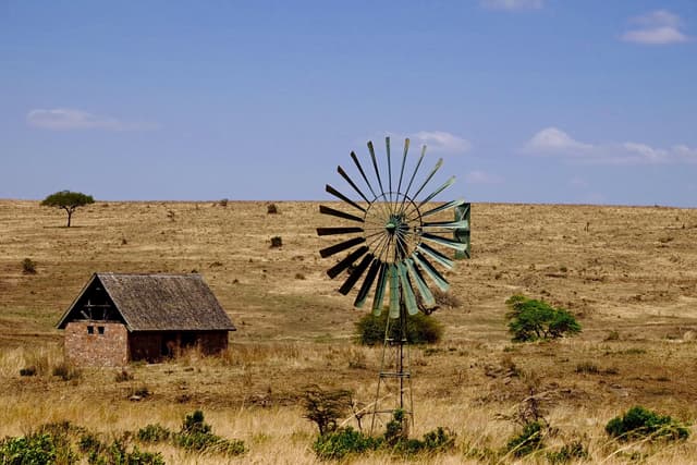 Image of a windmill in the plains in Africa.